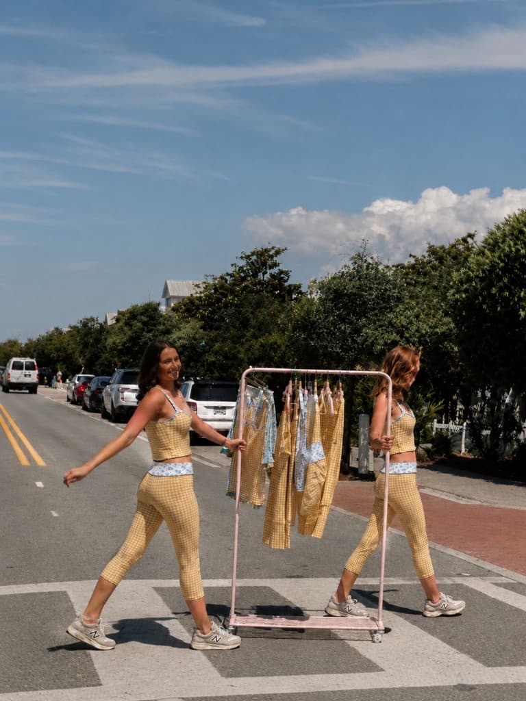 Friends in matching sets crossing the street